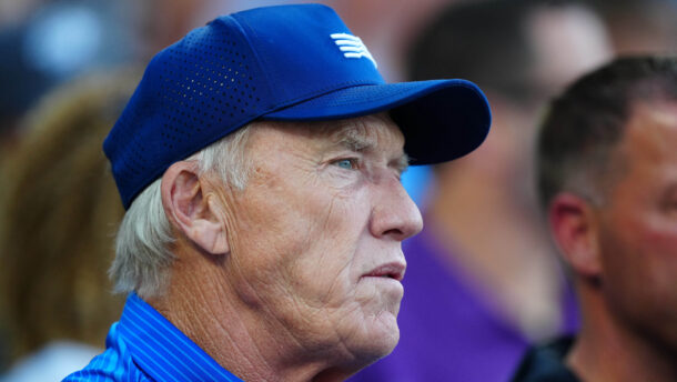 John Elway attends a baseball game.