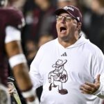 Mike Elko coaches during a game.