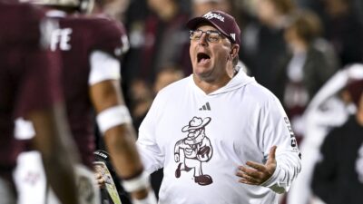 Mike Elko coaches during a game.