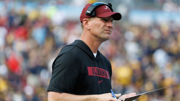 Kalen DeBoer coaches during a game.