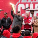 Ohio State coach Ryan Day holds the CFP trophy.