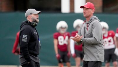 Kalen DeBoer and Ryan Grubb talk during an Alabama spring practice.