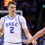 Duke's Cooper Flagg high-fives a teammate during a game.
