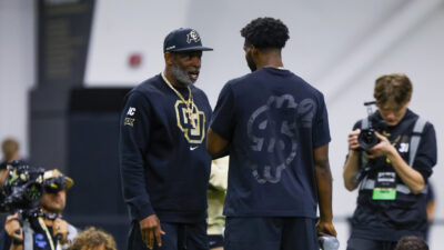 Deion Sanders and Shedeur Sanders talk.
