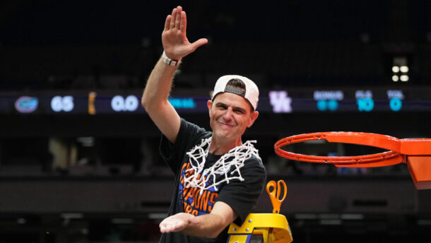 Todd Golden does the Gator chomp after winning the national championship.