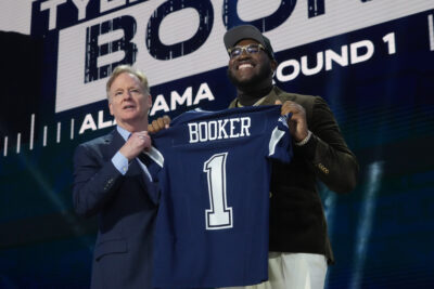 Tyler Booker shown on stage at NFL Draft.
