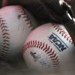 Baseballs in a glove.