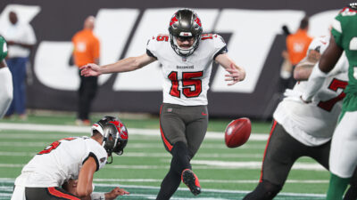Rodrigo Blankenship kicks a field goal.