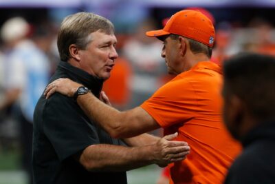 Dabo Swinney and Kirby Smart shake hands.