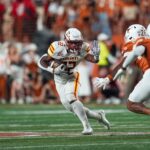Ahmad Hardy runs the ball.