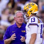 Brian Kelly and Garrett Nussmeier have a discussion on the LSU sideline.
