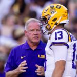 Brian Kelly and Garrett Nussmeier have a discussion on the LSU sideline.