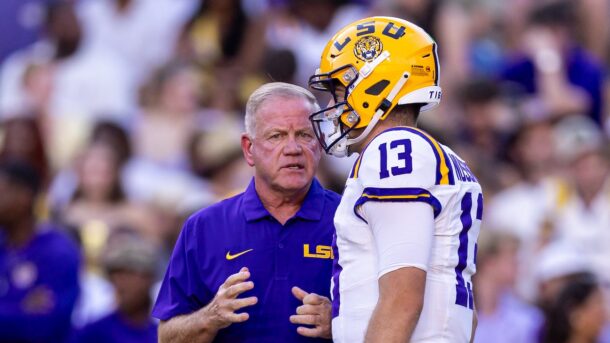 Brian Kelly and Garrett Nussmeier have a discussion on the LSU sideline.