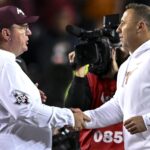 Texas coach Steve Sarkisian and Texas A&M coach Mike Elko shake hands.