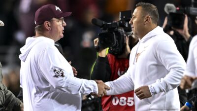 Texas coach Steve Sarkisian and Texas A&M coach Mike Elko shake hands.