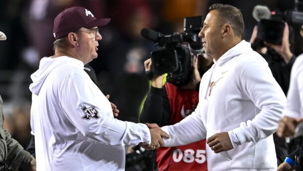 Texas coach Steve Sarkisian and Texas A&M coach Mike Elko shake hands.