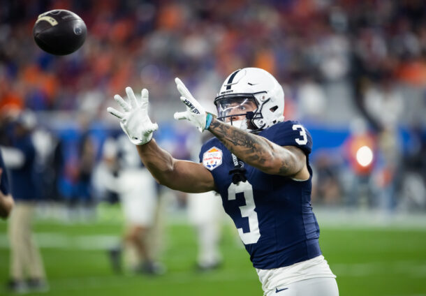 Penn State wide receiver Julian Fleming catches a pass in warmups.