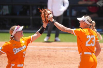 Tennessee softball players celebrate an out.
