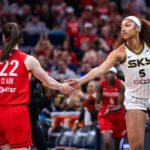 Caitlin Clark and Angel Reese face off.