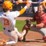 Alabama's catcher tags out a Tennessee base runner.