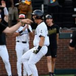Wright State coach Alex Sogard argues as Vanderbilt's Riley Nelson celebrates.
