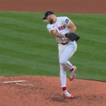 Garrett Crochet fields a ball.