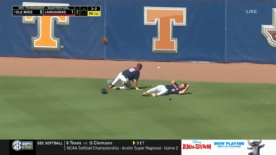Ole Miss OFs crash while chasing a fly ball.