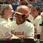 Texas celebrates Kayden Henry's home run.