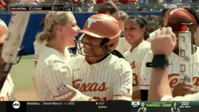 Texas celebrates Kayden Henry's home run.