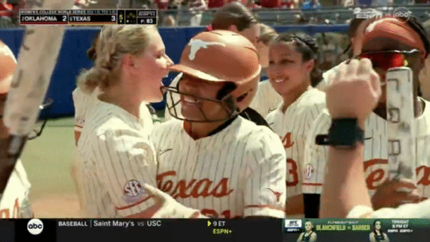 Texas celebrates Kayden Henry's home run.
