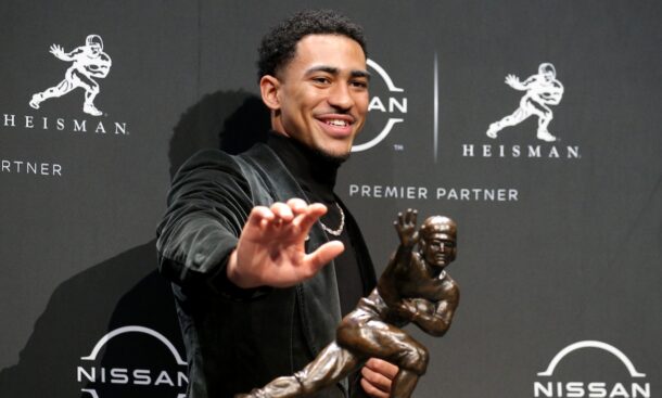 Bryce Young poses with his Heisman Trophy.