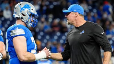 Detroit Lions center Frank Ragnow and head coach Dan Campbell.