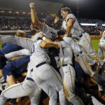Murray State players celebrate after beating Ole Miss in the Oxford Regional.