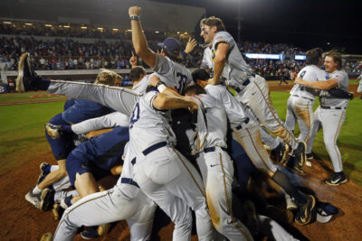 Murray State players celebrate after beating Ole Miss in the Oxford Regional.