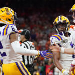 LSU quarterback Joe Burrow celebrates with wide receiver Justin Jefferson.