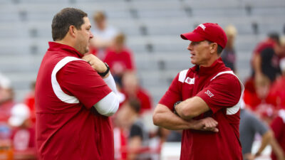 Jeff Lebby and Brent Venables on the field with Oklahoma.