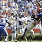 Eli Manning attempts a pass for Ole Miss against Florida.