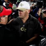 Georgia Tech head coach Brent Key shakes hands with Georgia head coach Kirby Smart.