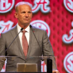 Kalen DeBoer speaks at SEC Media Days in 2024.