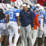 Lane Kiffin coaches Austin Simmons.