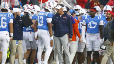 Lane Kiffin coaches Austin Simmons.