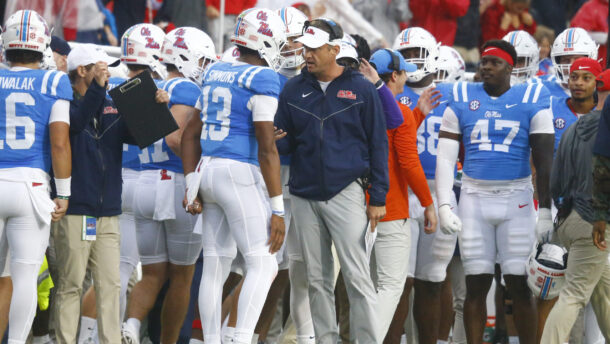 Lane Kiffin coaches Austin Simmons.