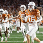 Texas safety Michael Taaffe celebrates with teammates.