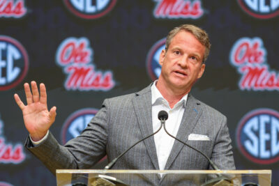 Lane Kiffin speaks at a press conference.