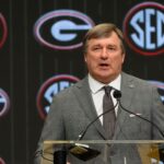 Kirby Smart speaks from the podium at SEC Media Days.