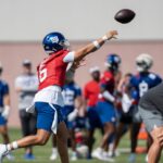 New York Giants QB Jaxson Dart throws a pass in training camp.