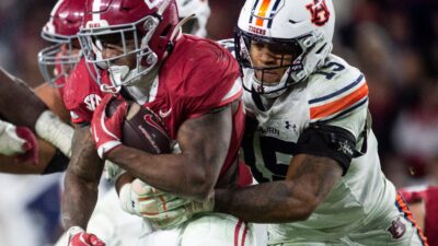 Auburn and Alabama play football.