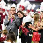 Terry Saban and Nick Saban on the field at a 2024 Alabama game.