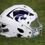 A Kansas State helmet is shown.