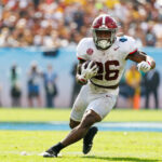 Alabama running back Jam Miller carries the ball.